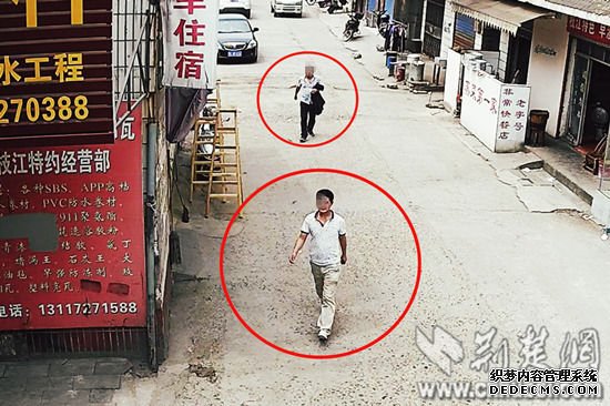 前面男子为嫌疑人谭某